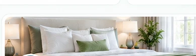 Professional cleaner refreshing a bright bedroom